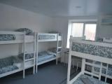 Спальное место на двухъярусной кровати в общем номере для мужчин и женщин