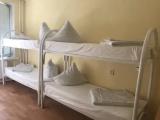 Спальное место на двухъярусной кровати в общем номере для женщин
