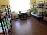 Спальное место на двухъярусной кровати в общем номере для мужчин и женщин