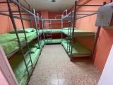 Спальное место на двухъярусной кровати в общем номере для женщин