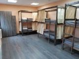Спальное место на двухъярусной кровати в общем номере для мужчин 