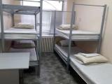 Спальное место на двухъярусной кровати в общем номере для мужчин 