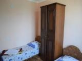 Трехместный номер эконом-класса с общей ванной комнатой