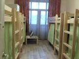 Спальное место на двухъярусной кровати в общем номере для мужчин 