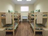 Спальное место на двухъярусной кровати в общем номере для женщин
