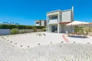 Villa Ermis, Коскину