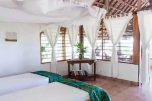 Capricorn Beach Cottages, Пангани