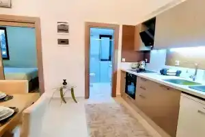 Central Flat With Shared Pool In Kepez Antalya, Анталья