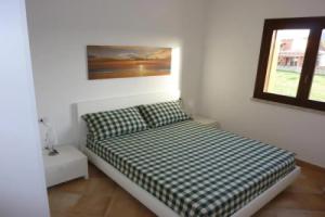 Appartamento in residence fronte mare, Murta Maria