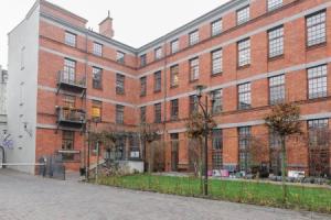 Dwupoziomowy loft w Tobaco Park, Лодзь