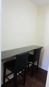 Village Inn & Suites - - 9