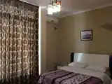 Четырёхместный номер Стандарт с балконом и с частичным видом на море