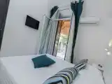 Трёхместный номер Стандарт с балконом и с видом на сад