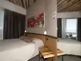 Четырёхместный номер Deluxe с балконом и с видом на море