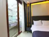 Трёхместный номер Deluxe с балконом