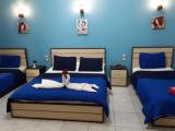 Четырёхместный номер Deluxe с балконом и с видом на город