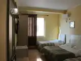 Четырёхместный номер Стандарт с частичным видом на море