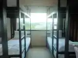 Кровать в общем номере c 1 комнатой с балконом