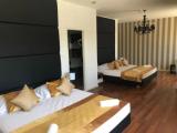 Четырёхместный номер Deluxe с балконом и с видом на море