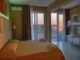 Четырёхместный номер Стандарт с частичным видом на море