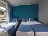 Трёхместный номер с частичным видом на море