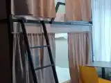Кровать в общем номере (женский номер) с видом на город