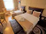 Трёхместный номер Делюкс