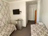 Четырёхместный номер Комфорт с балконом и с красивым видом из окна