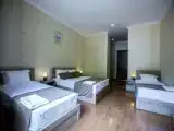 Четырёхместный номер Стандарт с балконом и с красивым видом из окна