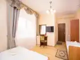 Четырёхместный номер Стандарт с балконом и с красивым видом из окна