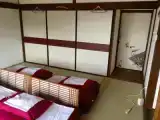 Четырёхместный номер (спальные места—футоны) с видом на море