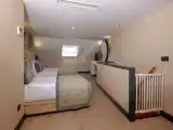 Четырёхместный номер Family Дуплекс с видом на окрестности