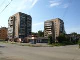 two buildings and supermarket between two buildings and supermarket between