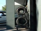 tires on a rack behind North Hills Exxon, 10-11-10