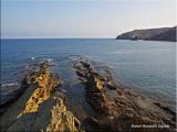 Como brazos de roca para abrazar la Mar