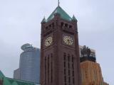 Clocktower and skyscrapers
