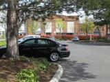 Parking lot on the corner of Railroad Avenue (on the left) and York Street (between reddish hedge and the building. Bellingham, Whatcom County, Washington. Parking lot on the corner of Railroad Avenue (on the left) and York Street (between reddish hedge and the building. Bellingham, Whatcom County, Washington.