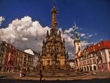 Horní náměstí s bouřkovým mrakem, Sloupem Nejsvětější Trojice a radnicí (the Upper Square with a storm cloud, the Holy Trinity Column and the townhall) Horní náměstí s bouřkovým mrakem, Sloupem Nejsvětější Trojice a radnicí (the Upper Square with a storm cloud, the Holy Trinity Column and the townhall)