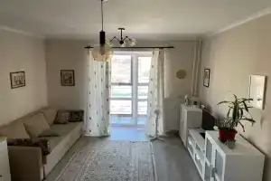 Уютная студия в новом доме Олимпии