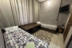 Двухместный номер с 2 отдельными кроватями бюджетный двухместный с собственным туалетом/душем