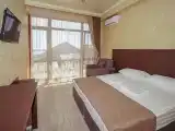 Трёхместный номер улучшенный с балконом