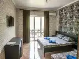 Трёхместный номер улучшенный с видом на горы