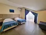 Двухместный номер с 2 отдельными кроватями улучшенный стандарт мансардный Sutwin-M с балконом