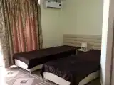 Двухместный номер с 2 отдельными кроватями и дополнительным местом