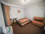Четырёхместный номер улучшенный стандарт с балконом