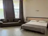 Четырёхместный номер Студио с балконом