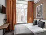 Апартаменты студия с мини-кухней с одной двуспальной или двумя односпальными кроватями