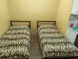 Четырёхместный номер с 1 кроватью и двумя отдельными кроватями диваном