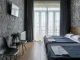 Трёхместный номер улучшенный с видом на город