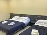 Трёхместный номер с тремя односпальными кроватями